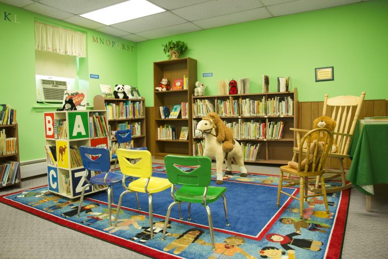 The Cat in the Hat reads at the Library